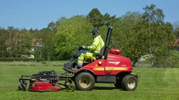 Riding mower in the north soccer field in Brastad How To Make A Riding Mower Faster