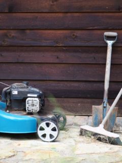 Lawn mower in front of a wooden wall—how to keep mice out of lawn mower