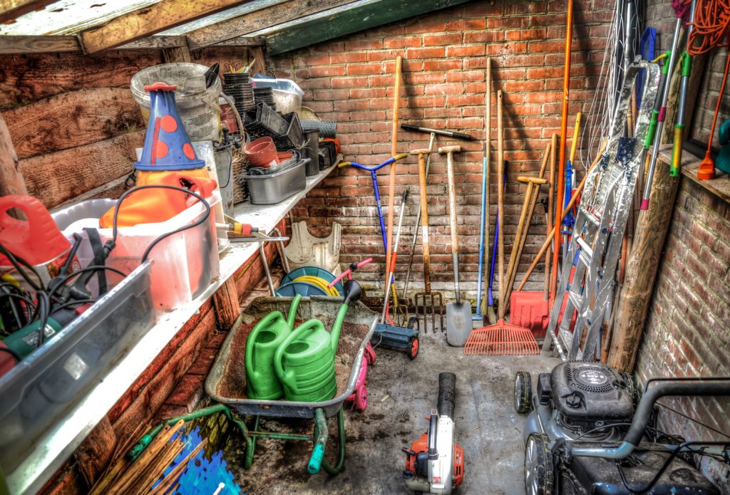 A garden shed—how to cut grass near a fence?