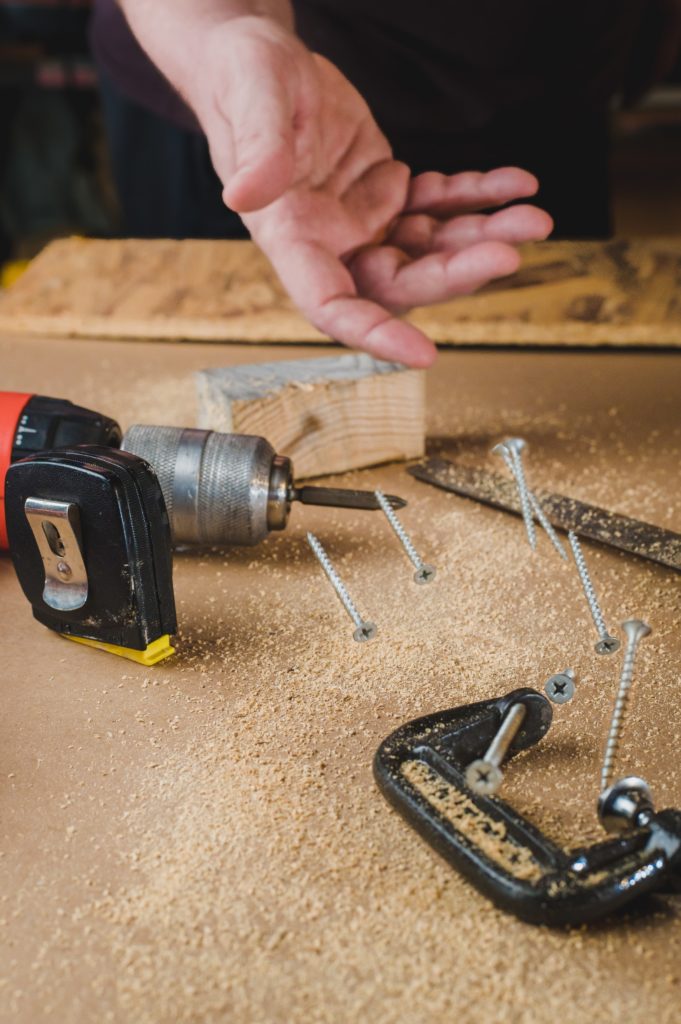 Carpenter throws screws on a workbench—how to make wood glue dry faster?