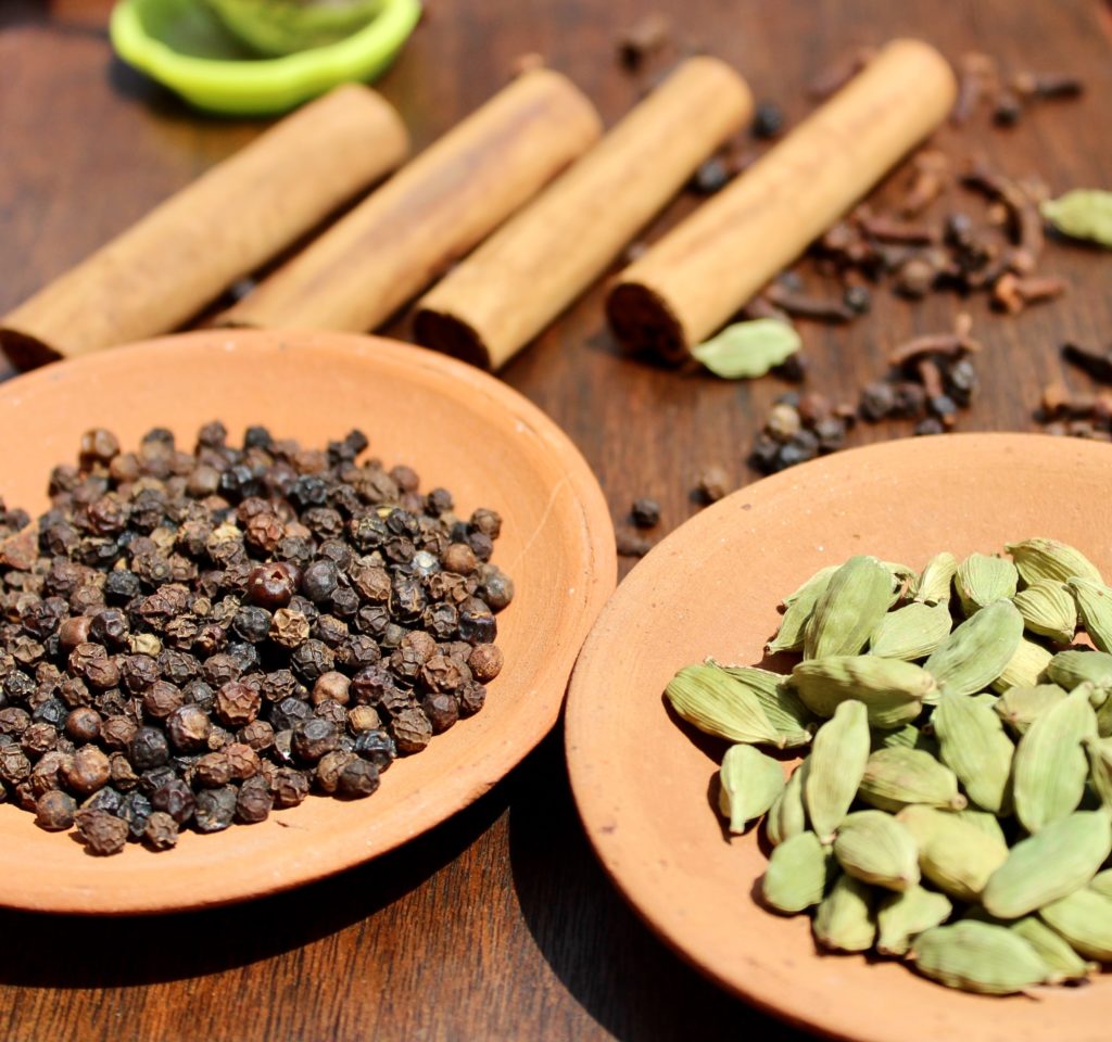 Spices in plates on the table—why is cardamom so expensive?