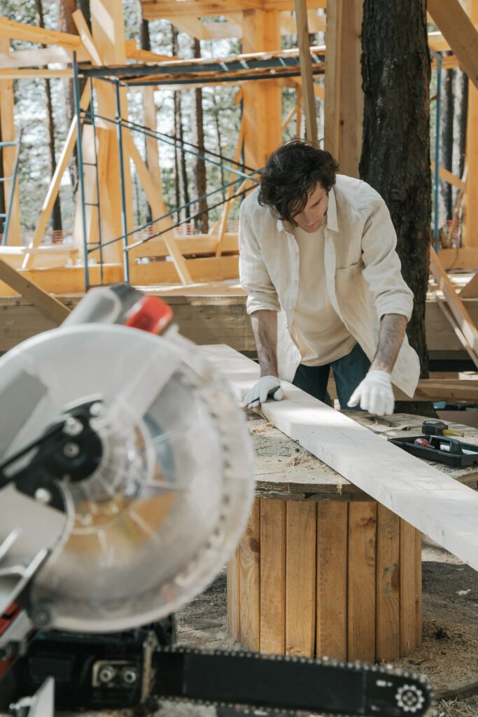 Person marking a wood piece—how to cut a 22.5 degree angle on a miter saw?