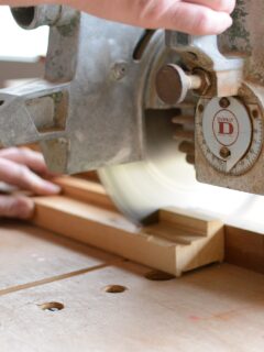 A-person-cutting-wood-with-a-miter-saw—can-a-10-inch-miter-saw-cut-a-4x4-?